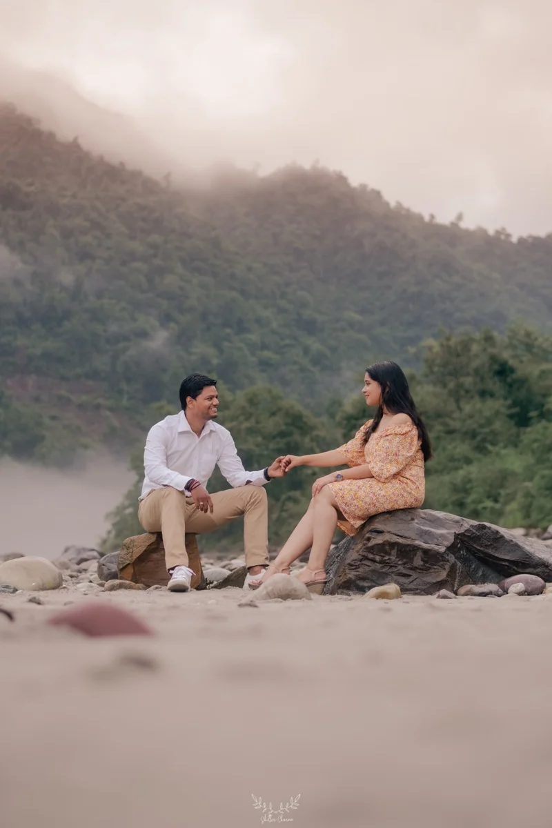 Couple by a misty river in Rishikesh
