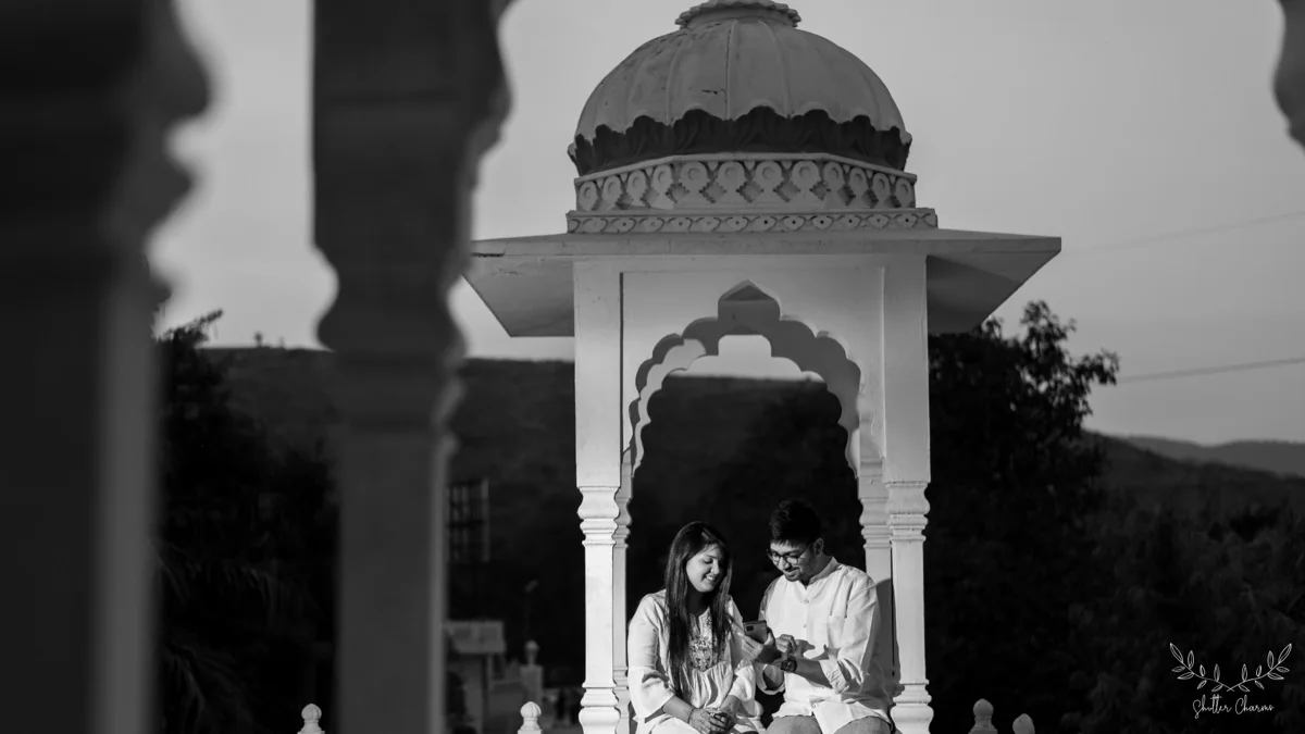Couple sharing a quiet moment in a temple gazebo