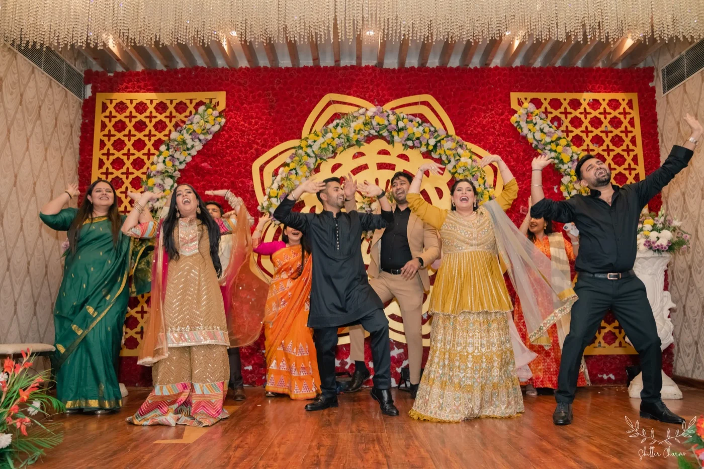 Family dancing on stage at the sangeet