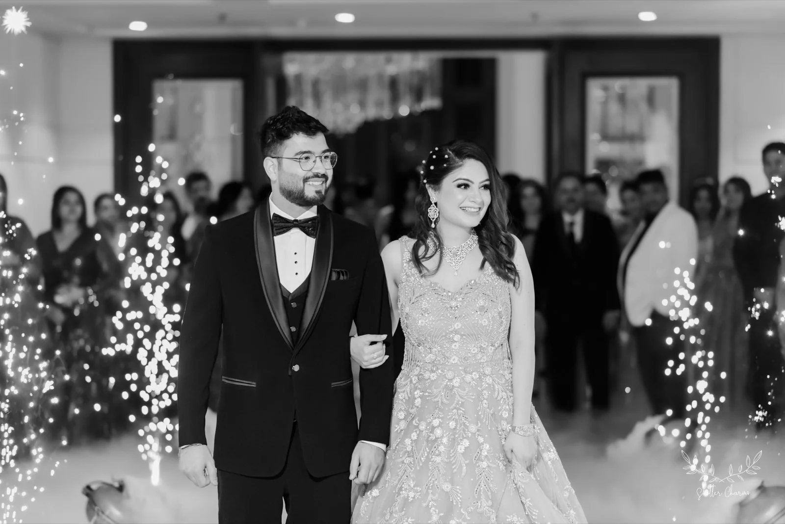 Bride and groom making a sparkler-lit grand reception entry