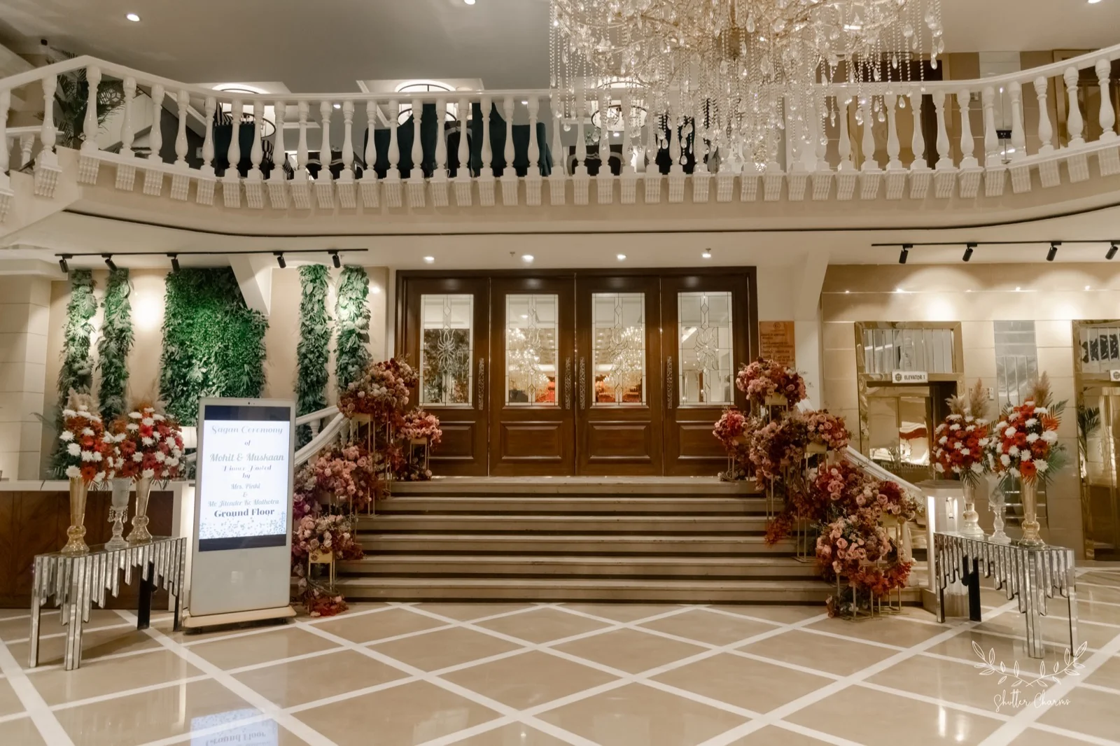 Flower-lined venue entrance with welcome signage for the sagan ceremony